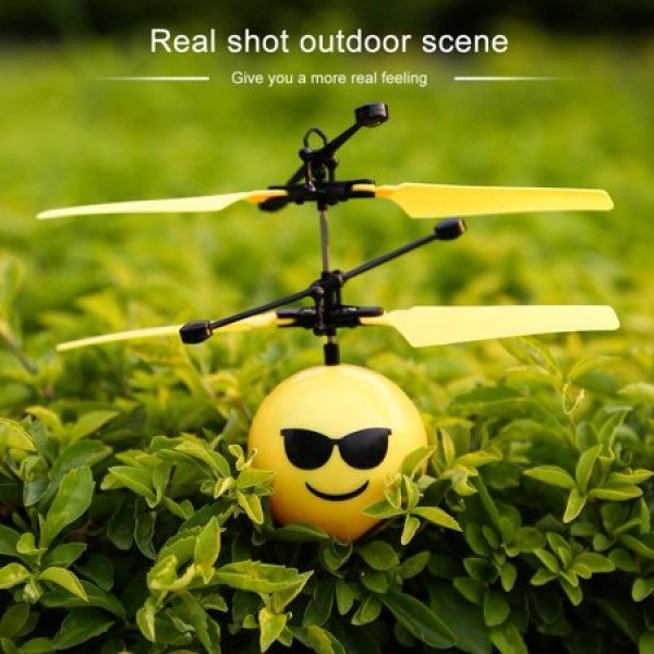 Cute Facial Expression Infrared Induction Flying Flash Disco LED Ball Toy Yellow